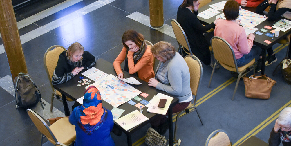 Een zaal vol spelers van de serious game 'Buurtgenoten'