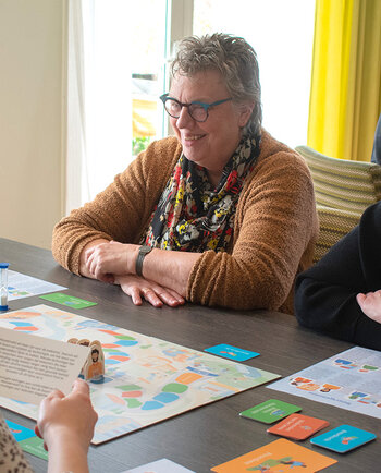 Spelers spelen het Samenspel Buurtgenoten.